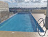 A Lovely 3-Bedroom Apartment with a Rooftop Pool
